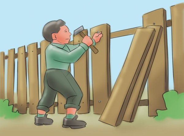 Мальчик чинит забор